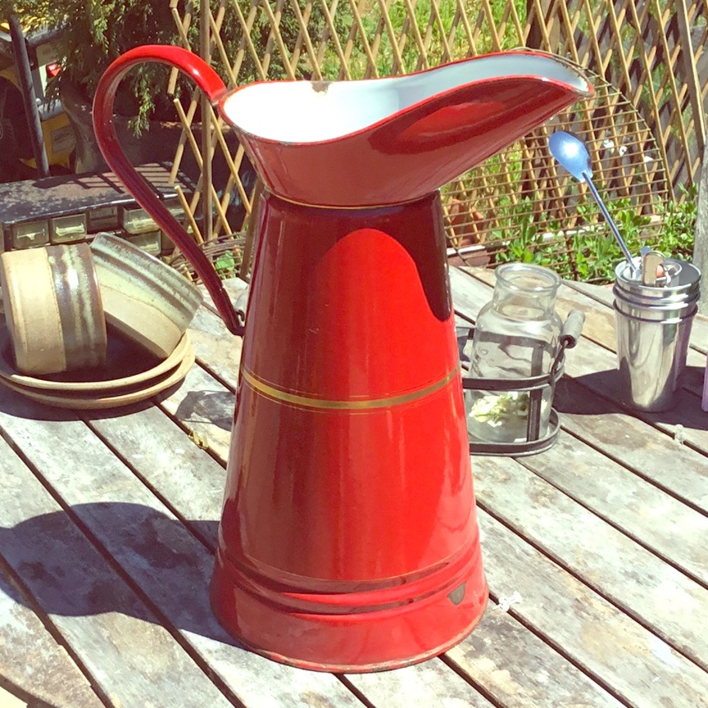 Large French vintage enamel red pitcher.